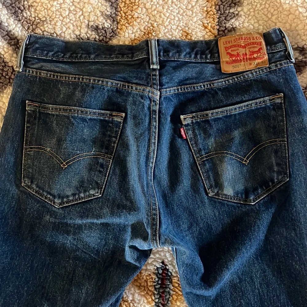 Dark wash distressed Levi 501 jeans